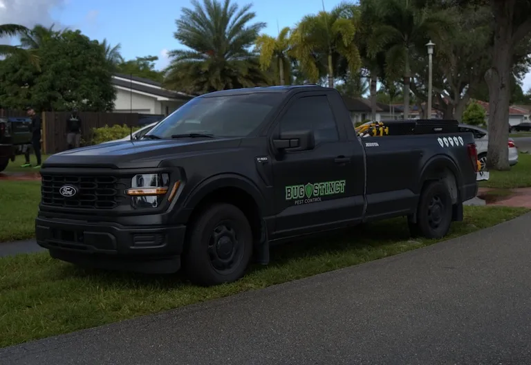 BUGSTINCT technician performing commercial pest control inspection